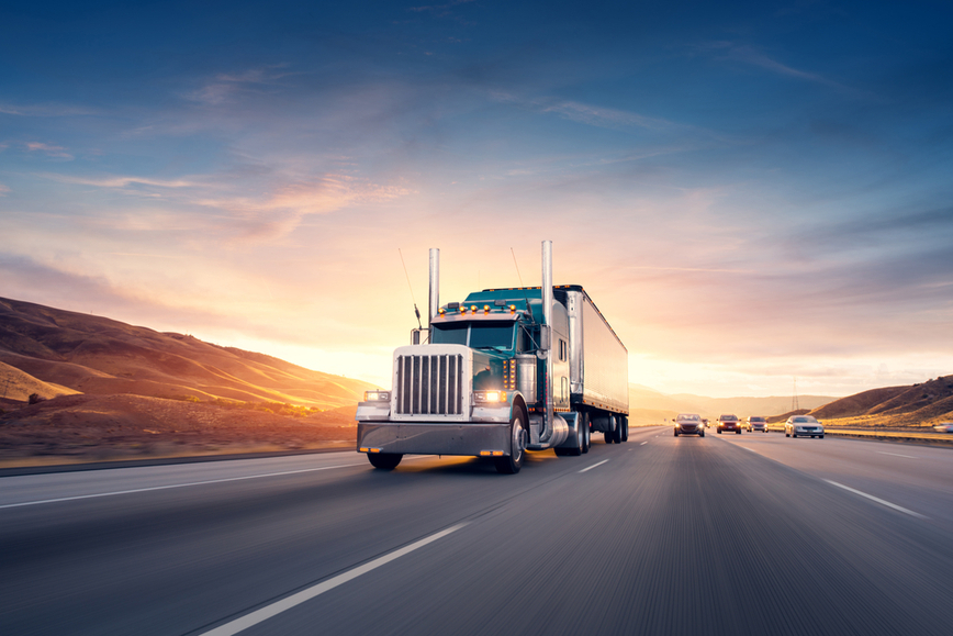 Semi-truck traveling down a highway